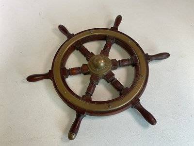 Lot 22 - A teak brass mounted six spoke ship's wheel,...