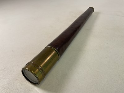 Lot 17 - A large brass single drawer telescope with...