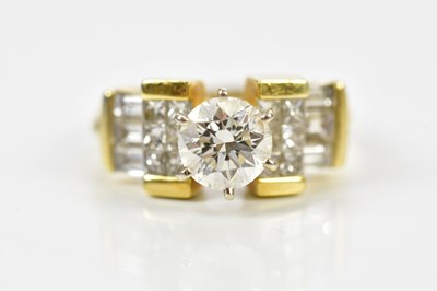 Lot 25 - An 18ct yellow gold and diamond ring, the...