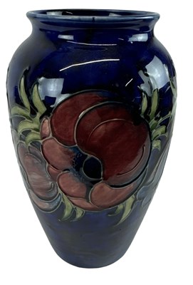 Lot 633 - MOORCROFT; a blue ground vase in the 'Anemone'...