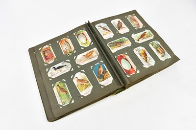 Lot 616 - An album of cigarette cards, to include Will’s...