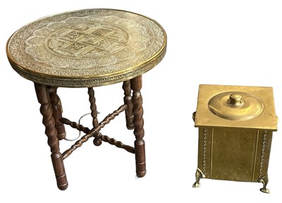 Lot 557 - A folding brass topped circular coffee table,...