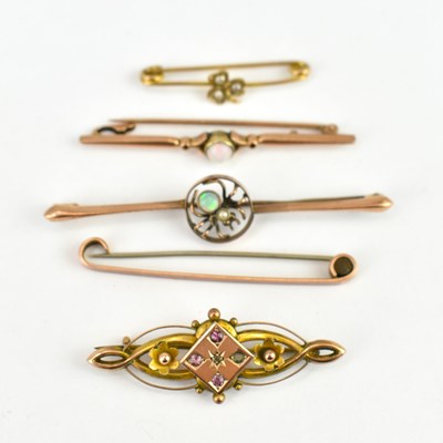 Lot 1066 - Five 9ct gold bar brooches, one set with opal,...