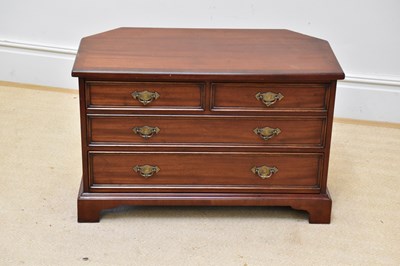 Lot 1133 - A reproduction mahogany TV/media unit, width...