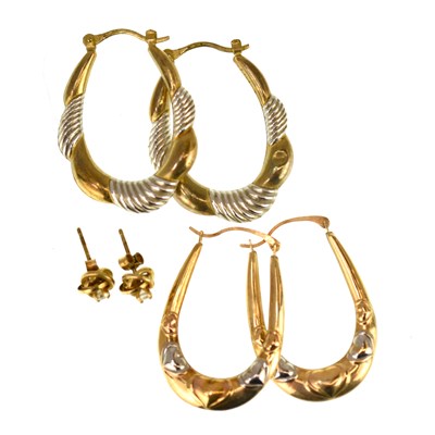 Lot 1105 - Two pairs of 9ct gold hoop earrings and a pair...