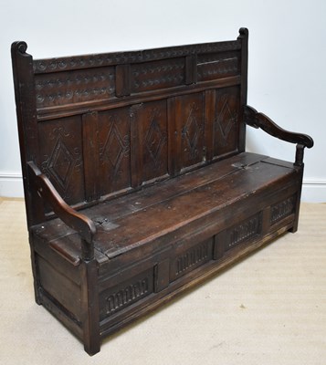 Lot 1160 - A large 18th century oak five panel settle,...