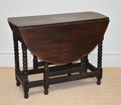 Lot 1284 - A 19th century oak gateleg table, with single...