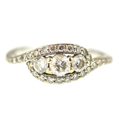 Lot 1007 - An 18ct white gold ring set with three...