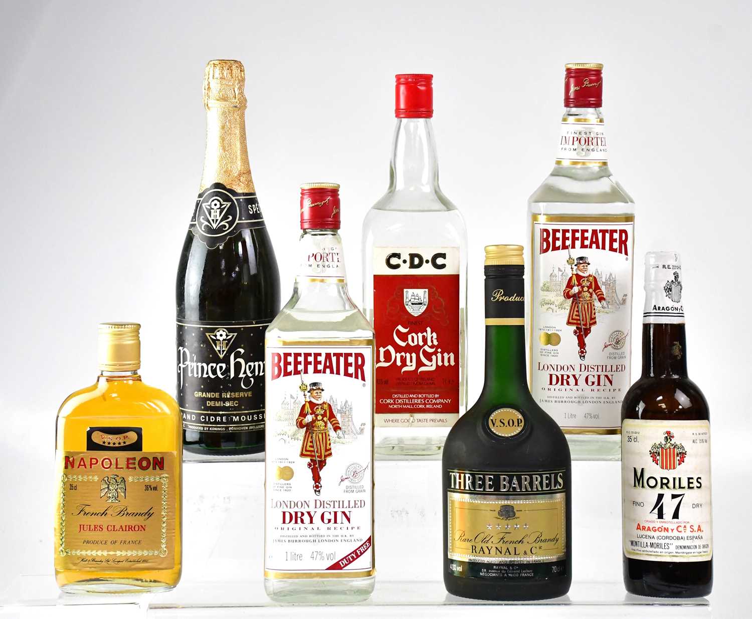Lot 144 - A small mixed lot of spirits to include two...