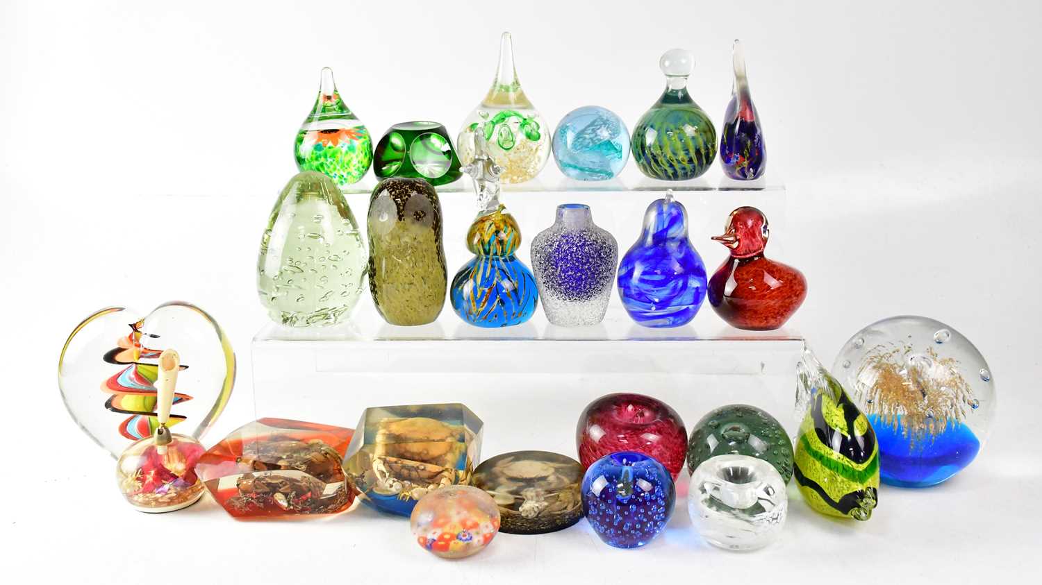 Lot 443 - Twenty-four glass and plastic paperweights,...