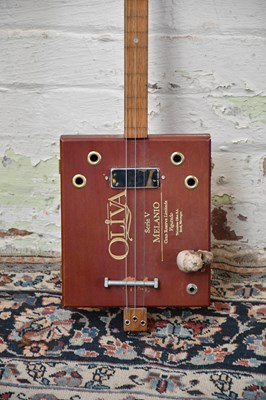 Lot 1584 - A scratch built three string cigar box guitar.