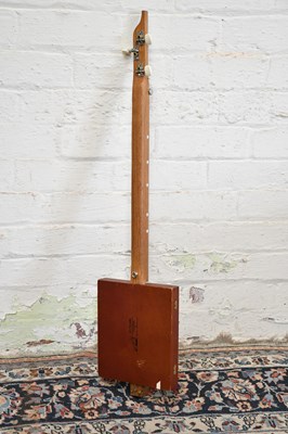 Lot 1584 - A scratch built three string cigar box guitar.