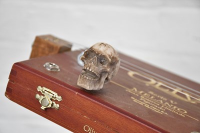 Lot 1584 - A scratch built three string cigar box guitar.