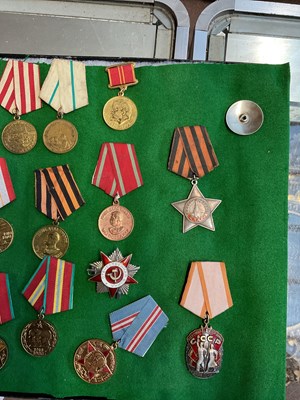 Lot 406 - A collection of Russian medals and orders to...