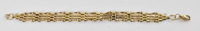 Lot 1307 - A 9ct yellow gold gate link bracelet, length...