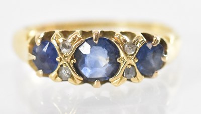 Lot 1278 - An 18ct yellow gold blue stone and diamond set...