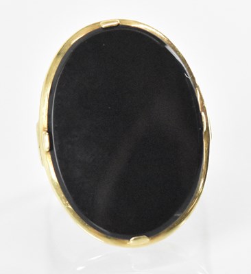 Lot 1277 - A 14ct yellow gold onyx set ring, onyx...