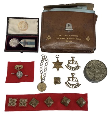 Lot 398 - A group of military medals and badges...