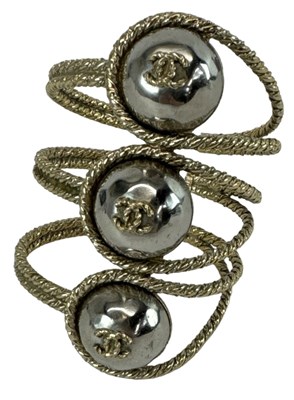 Lot 1239 - IN THE STYLE OF CHANEL; a yellow metal triple '...