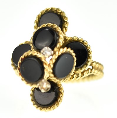 Lot 913 - An 18ct gold contemporary ring with six black...