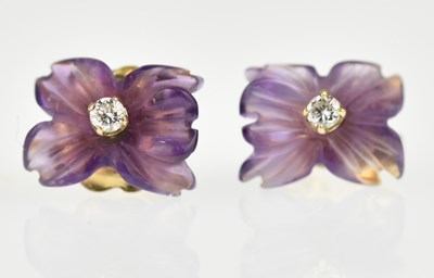 Lot 1103 - A pair of 9ct gold earrings with claw set tiny...
