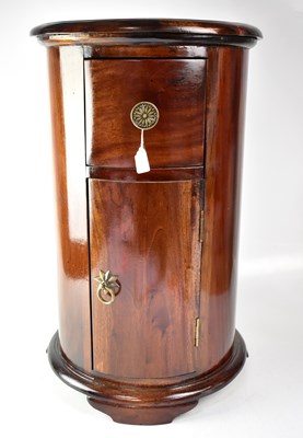 Lot 51 - A 19th century style mahogany drum bedside...