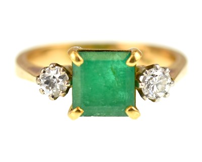Lot 1014 - A 14ct gold emerald and diamond ring, the claw...