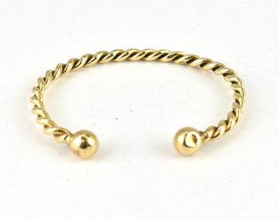 Lot 1050 - A 9ct gold twist torc bracelet, length 7cm,...