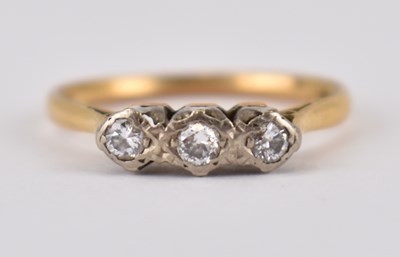 Lot 994 - An 18ct gold ring, with three tiny illusion...