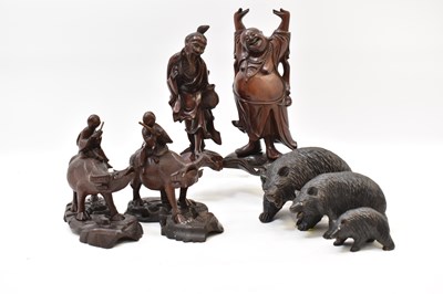 Lot 152 - Four Oriental carved wood figures comprising a...