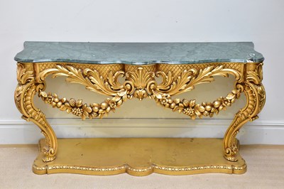 Lot 1146 - A large modern gilt serpentine marble topped...