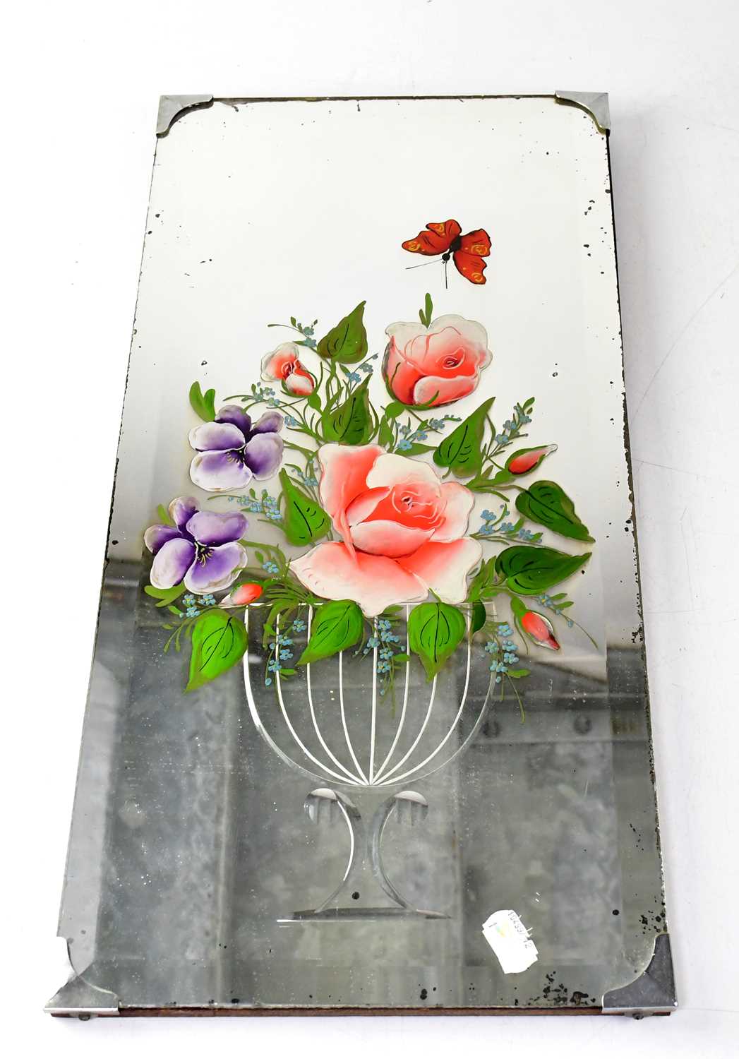 Lot 69 - A 1930s painted glass mirror with etched vase,...