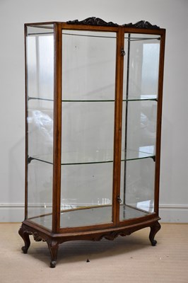 Lot 1155 - A 19th century carved oak bowfronted vitrine...