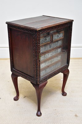 Lot 1283 - An unusual cabinet, with single glazed door...