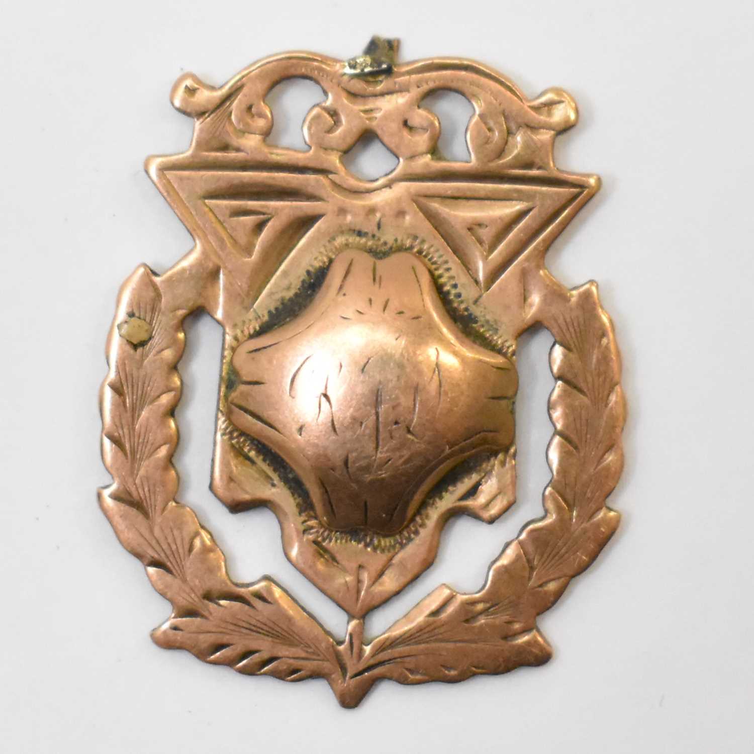 Lot 1113 - A 9ct gold prize fob, blank back with rubbed...
