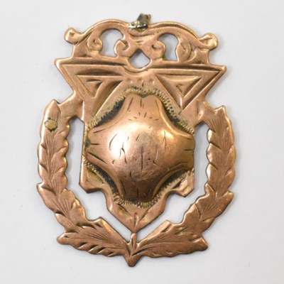 Lot 1113 - A 9ct gold prize fob, blank back with rubbed...