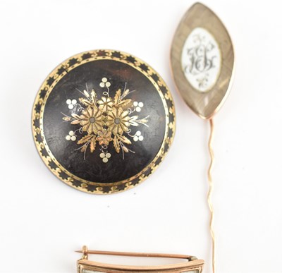 Lot 1067 - Three early 19th century mourning brooches,...