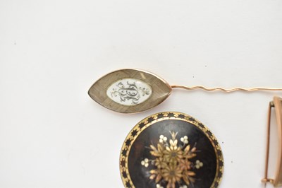 Lot 1067 - Three early 19th century mourning brooches,...