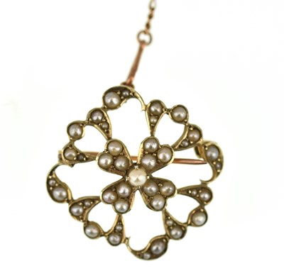 Lot 1060 - An Edwardian 9ct gold openwork seed pearl clad...
