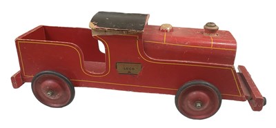 Lot 569 - TRI-ANG; a large wooden toy model of a train, '...