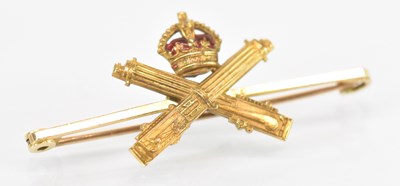 Lot 1373 - A 15ct yellow gold brooch with crown...