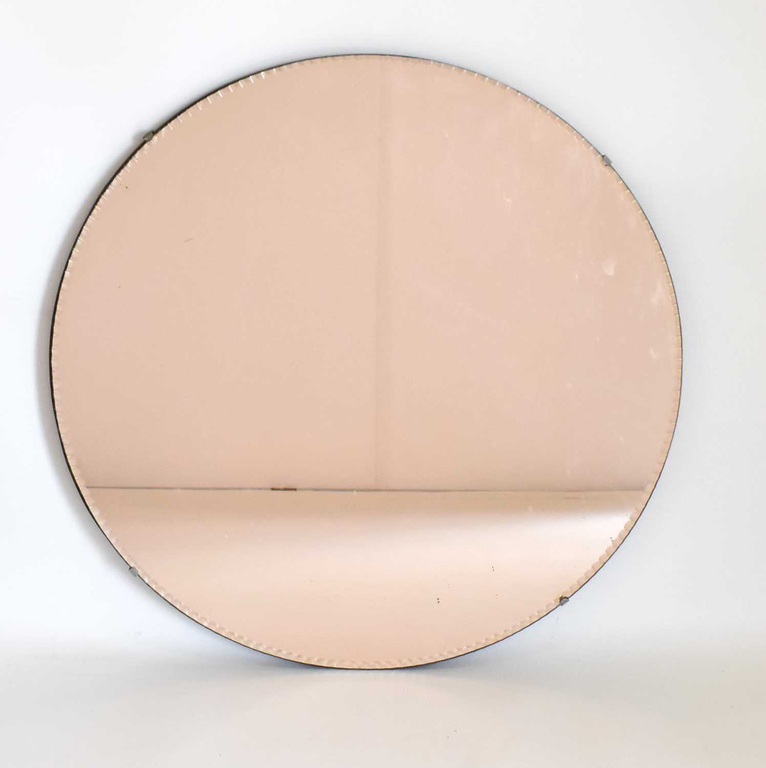 Lot 71 - A vintage copper tone circular wall mirror...