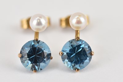 Lot 1102 - A pair of 9ct yellow gold stud earrings with...