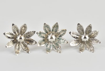 Lot 1106 - Three white gold flower stud earrings,...