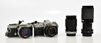 Lot 483 - Two 35mm film cameras and lenses, comprising...