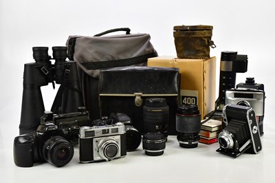 Lot 526 - A collection of cameras and accessories,  to...