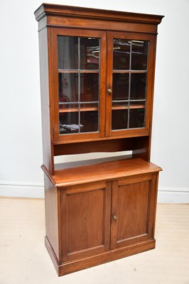 Lot 1217 - An Edwardian walnut bookcase, with two glazed...