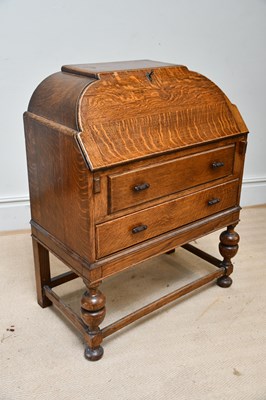 Lot 1241 - A 1930s late Art Deco oak bureau, with fall...