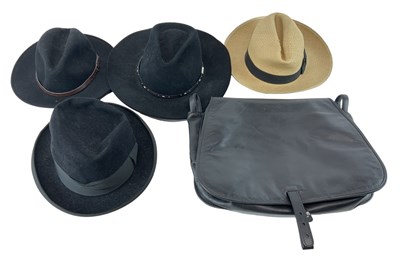 Lot 527 - A group of four hats including a Dunhill...