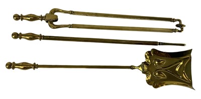 Lot 561 - An early 20th century brass three piece...